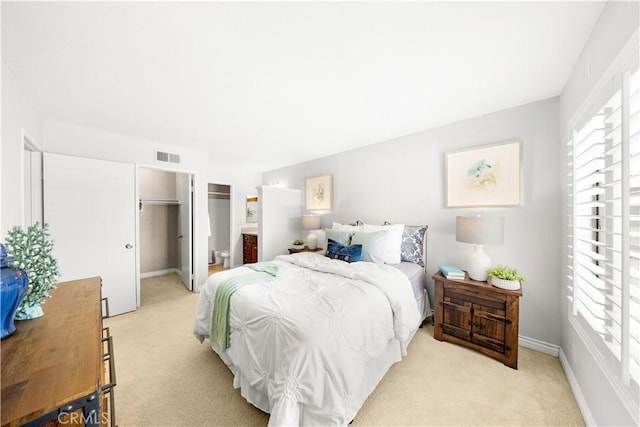67 Remington Unit 231, Irvine, CA 92620 - bedroom with light colored carpet, a spacious closet, and a closet