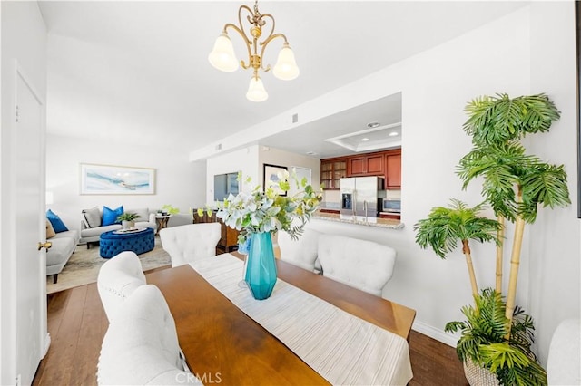 67 Remington Unit 231, Irvine, CA 92620 - dining space with wood finished floors, a chandelier, a tray ceiling, and recessed lighting