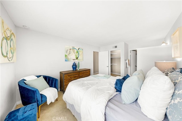 67 Remington Unit 231, Irvine, CA 92620 - bedroom with light colored carpet, a closet, and a spacious closet