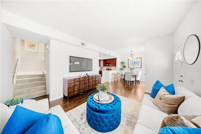 67 Remington Unit 231, Irvine, CA 92620 - living room with stairway and wood finished floors
