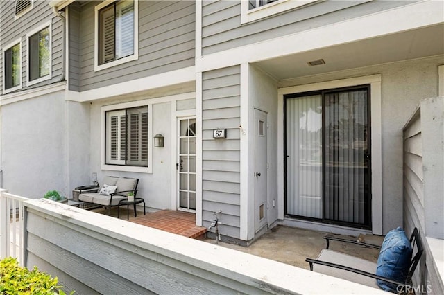 67 Remington Unit 231, Irvine, CA 92620 - property entrance featuring stucco siding