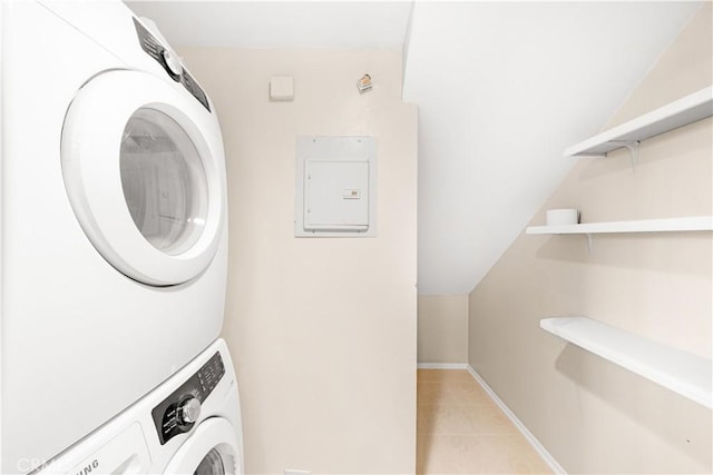 67 Remington Unit 231, Irvine, CA 92620 - laundry area featuring estacked washer and dryer, light tile patterned flooring, and electric panel