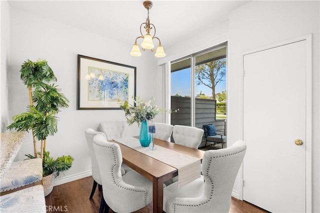 67 Remington Unit 231, Irvine, CA 92620 - dining space with a chandelier and dark wood-type flooring