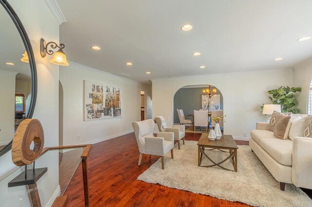 4280 Trias St, San Diego, CA 92103 - living room with arched walkways, recessed lighting, ornamental molding, wood finished floors, and a chandelier