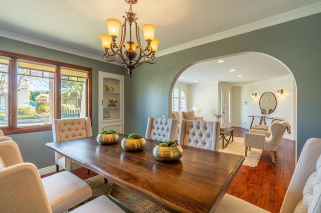 4280 Trias St, San Diego, CA 92103 - dining space featuring arched walkways, light wood-type flooring, a chandelier, ornamental molding, and recessed lighting