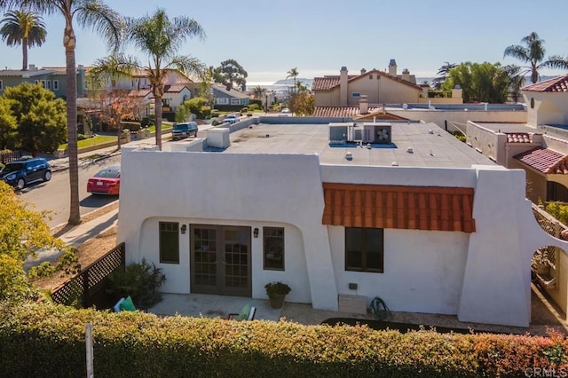 4280 Trias St, San Diego, CA 92103 - rear view of house with french doors, stucco siding, and a residential view
