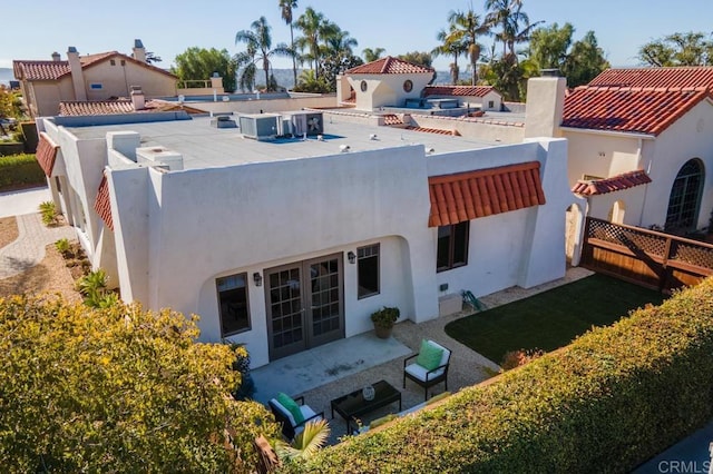 4280 Trias St, San Diego, CA 92103 - back of house with stucco siding, a chimney, french doors, and a patio