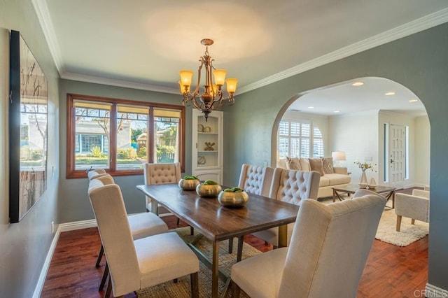 4280 Trias St, San Diego, CA 92103 - dining area featuring arched walkways, a chandelier, crown molding, and wood finished floors