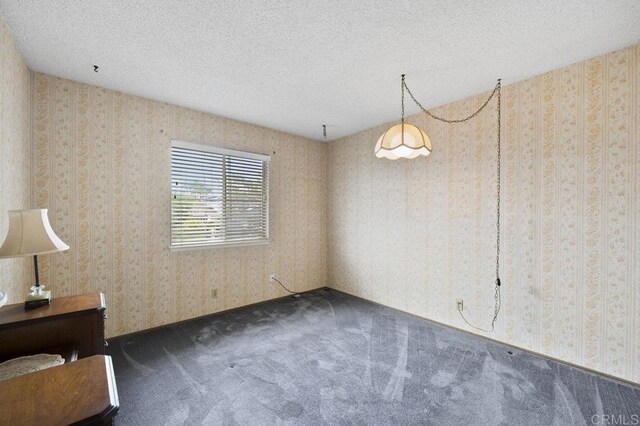 1113 Camino Del Sol Cir, Carlsbad, CA 92008 - carpeted empty room featuring a textured ceiling and wallpapered walls