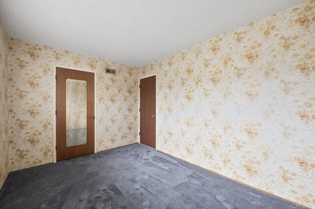 1113 Camino Del Sol Cir, Carlsbad, CA 92008 - spare room with carpet, a textured ceiling, and wallpapered walls