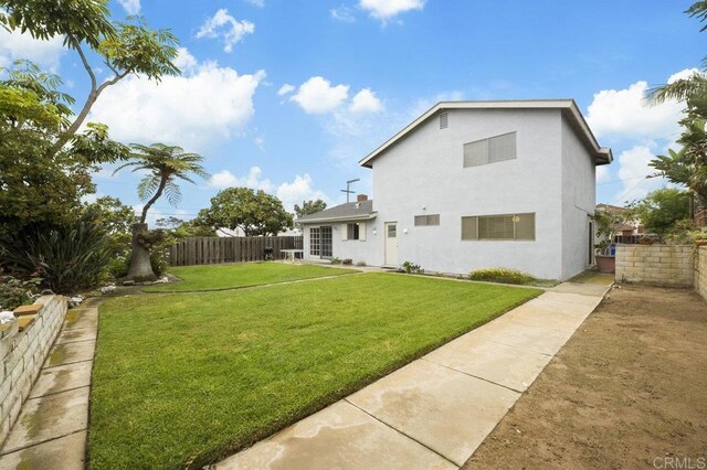 1113 Camino Del Sol Cir, Carlsbad, CA 92008 - rear view of property with a fenced backyard and stucco siding