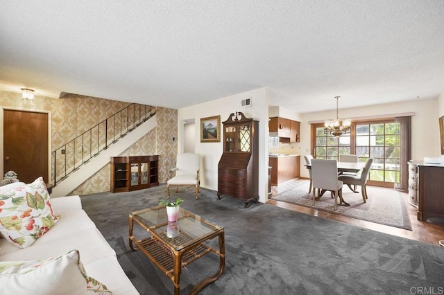 1113 Camino Del Sol Cir, Carlsbad, CA 92008 - living area featuring wallpapered walls, a chandelier, stairway, a textured ceiling, and carpet
