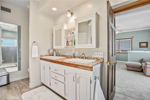 1440 8th St, Manhattan Beach, CA 90266 - bathroom with double vanity, wood finished floors, and ceiling fan