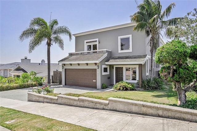 1440 8th St, Manhattan Beach, CA 90266 - view of front of home featuring a balcony, stucco siding, a garage, driveway, and a front yard