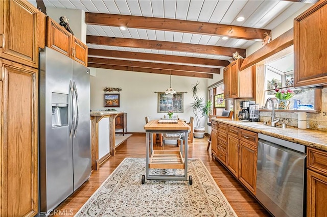 1440 8th St, Manhattan Beach, CA 90266 - kitchen featuring stainless steel appliances, light stone counters, a wood ceiling with exposed beams, brown cabinets, and light wood-style flooring