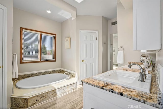 1440 8th St, Manhattan Beach, CA 90266 - full bathroom featuring a bath, vanity, and wood finished floors