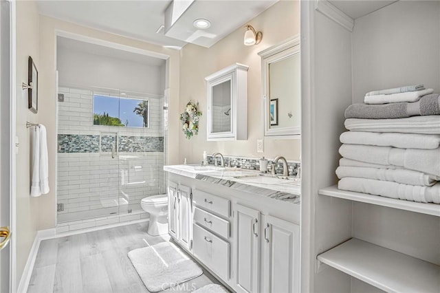 1440 8th St, Manhattan Beach, CA 90266 - full bath featuring double vanity, a stall shower, and wood finished floors