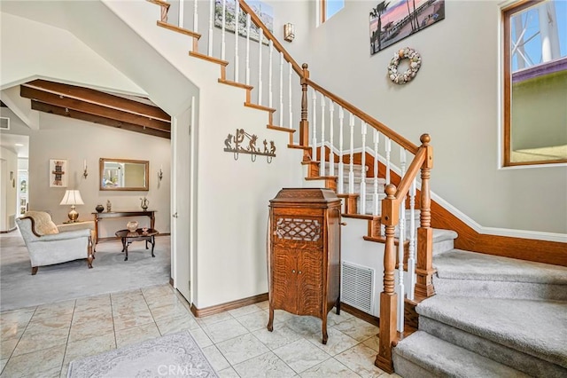 1440 8th St, Manhattan Beach, CA 90266 - stairway with beam ceiling and carpet floors