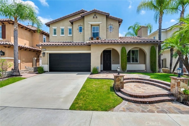 3820 Bidwell Dr, Yorba Linda, CA 92886 - mediterranean / spanish house featuring stucco siding, driveway, an attached garage, a tiled roof, and a front yard