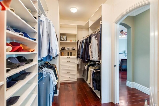 3820 Bidwell Dr, Yorba Linda, CA 92886 - spacious closet with dark wood-style floors and arched walkways