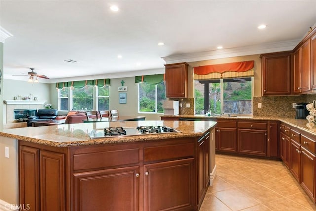 3820 Bidwell Dr, Yorba Linda, CA 92886 - kitchen featuring stainless steel gas stovetop, backsplash, crown molding, recessed lighting, and a kitchen island