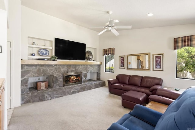 2221 Cortina Cir, Escondido, CA 92029 - carpeted living room featuring a fireplace, ceiling fan, recessed lighting, and built in shelves