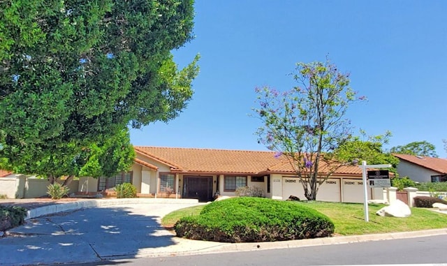 2221 Cortina Cir, Escondido, CA 92029 - ranch-style house with a garage, a tiled roof, concrete driveway, and stucco siding