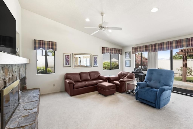 2221 Cortina Cir, Escondido, CA 92029 - carpeted living room featuring lofted ceiling, a stone fireplace, a ceiling fan, and recessed lighting