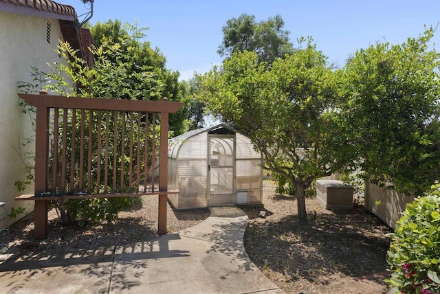2221 Cortina Cir, Escondido, CA 92029 - view of yard with an exterior structure and an outbuilding