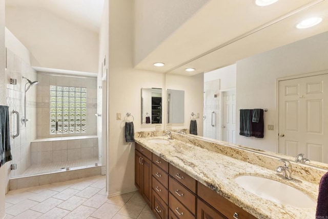 2221 Cortina Cir, Escondido, CA 92029 - full bathroom with a stall shower, double vanity, tile patterned flooring, recessed lighting, and lofted ceiling