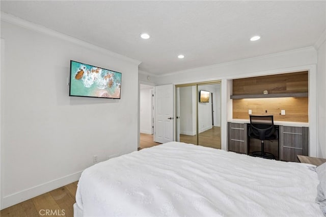 434 S Los Robles Ave Unit 4, Pasadena, CA 91101 - bedroom with crown molding, light wood-style flooring, recessed lighting, and a closet