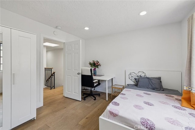 434 S Los Robles Ave Unit 4, Pasadena, CA 91101 - bedroom featuring wood finished floors, recessed lighting, and a textured ceiling