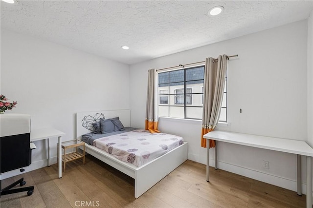 434 S Los Robles Ave Unit 4, Pasadena, CA 91101 - bedroom featuring wood finished floors, recessed lighting, and a textured ceiling