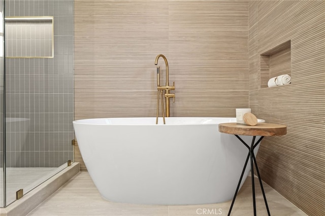 4016 Old Topanga Canyon Rd, Calabasas, CA 91302 - bathroom with a freestanding bath, a stall shower, and tile walls