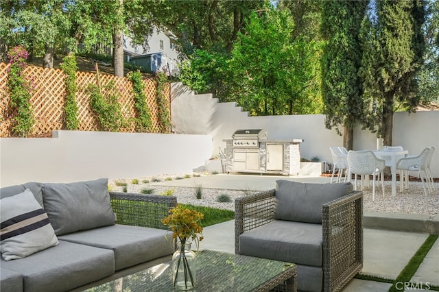 4016 Old Topanga Canyon Rd, Calabasas, CA 91302 - fenced backyard featuring a patio, an outdoor living space, and an outdoor kitchen