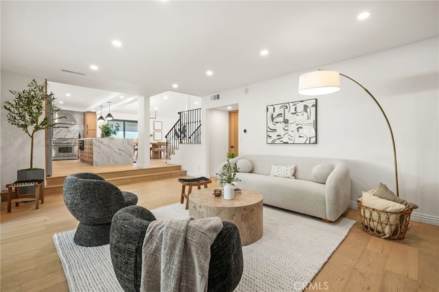 4016 Old Topanga Canyon Rd, Calabasas, CA 91302 - living room with light wood-type flooring, stairs, and recessed lighting