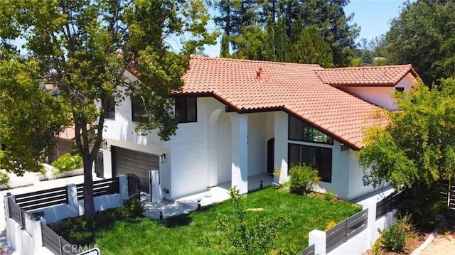 4016 Old Topanga Canyon Rd, Calabasas, CA 91302 - view of front of home with a tiled roof, stucco siding, and a garage