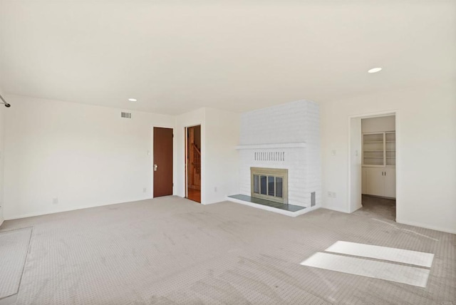5884 Redondo Dr, Bonsall, CA 92003 - unfurnished living room with carpet flooring, a brick fireplace, and recessed lighting