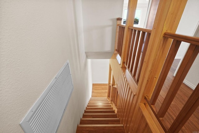 5884 Redondo Dr, Bonsall, CA 92003 - stairs with wood finished floors and a textured wall