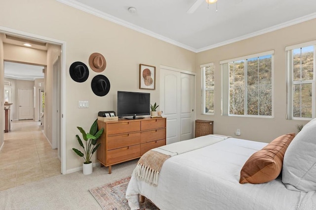 12737 Savannah Creek Dr Unit 280, San Diego, CA 92128 - bedroom featuring ornamental molding, a closet, light colored carpet, and a ceiling fan