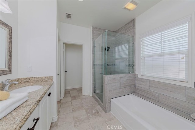 8647 Belmont St, Cypress, CA 90630 - full bathroom featuring a shower stall, vanity, and a garden tub