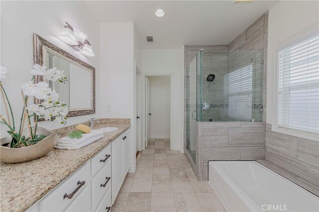 8647 Belmont St, Cypress, CA 90630 - bathroom with a shower stall, vanity, a bath, healthy amount of natural light, and recessed lighting