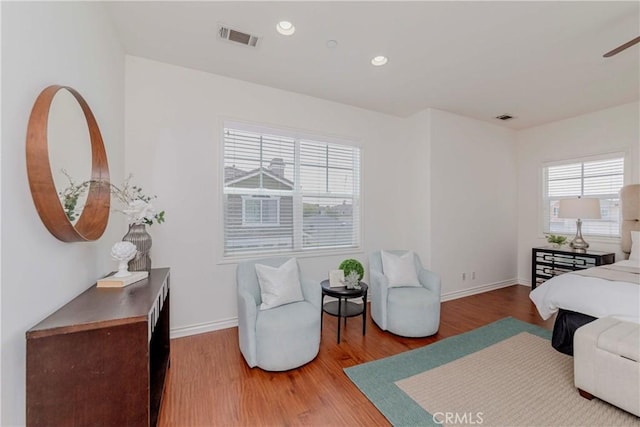 8647 Belmont St, Cypress, CA 90630 - bedroom featuring multiple windows, wood finished floors, and recessed lighting