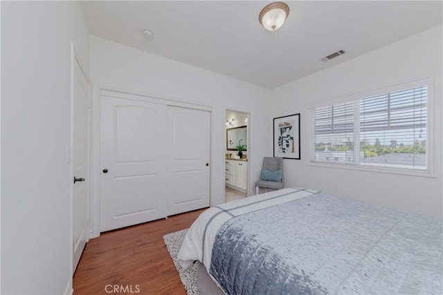 8647 Belmont St, Cypress, CA 90630 - bedroom with light wood-style flooring, a closet, and connected bathroom