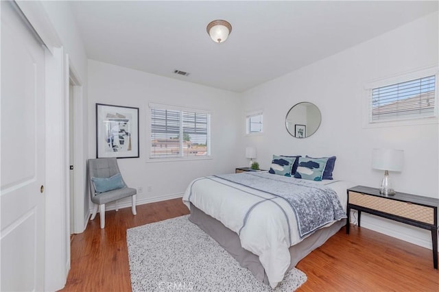 8647 Belmont St, Cypress, CA 90630 - bedroom featuring wood finished floors and baseboards