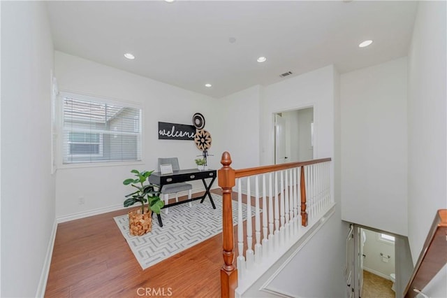 8647 Belmont St, Cypress, CA 90630 - hall featuring an upstairs landing, wood finished floors, recessed lighting, and an office area
