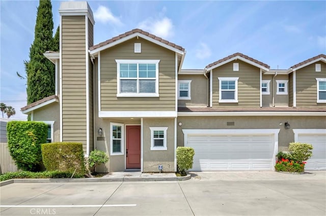8647 Belmont St, Cypress, CA 90630 - multi unit property with stucco siding, a chimney, and a tile roof