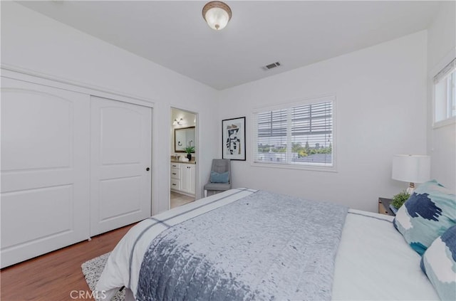8647 Belmont St, Cypress, CA 90630 - bedroom featuring wood finished floors, ensuite bathroom, and a closet