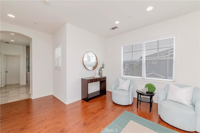 8647 Belmont St, Cypress, CA 90630 - sitting room featuring arched walkways, light wood-style floors, and recessed lighting