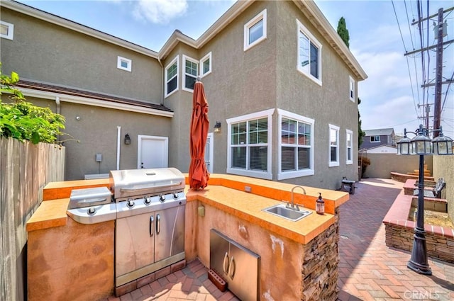 8647 Belmont St, Cypress, CA 90630 - fenced backyard with a patio and exterior kitchen